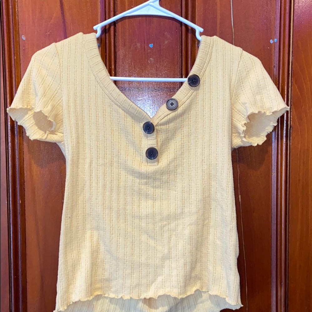 Yellow top with buttons
